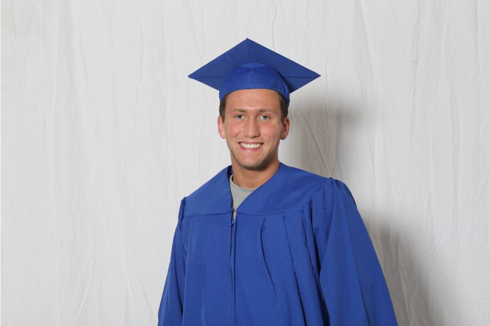 single man in cap and gown